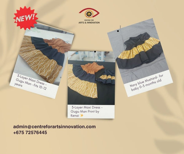 A bold Gugu Man print in rich navy blue and mustard tones
 Three elegant layers for a flowy, twir...