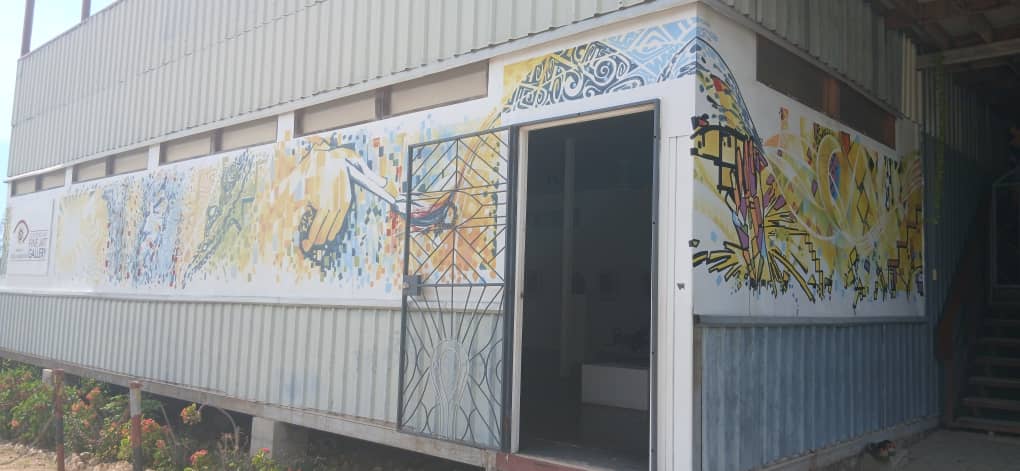 Building with colorful mosaic art on its facade