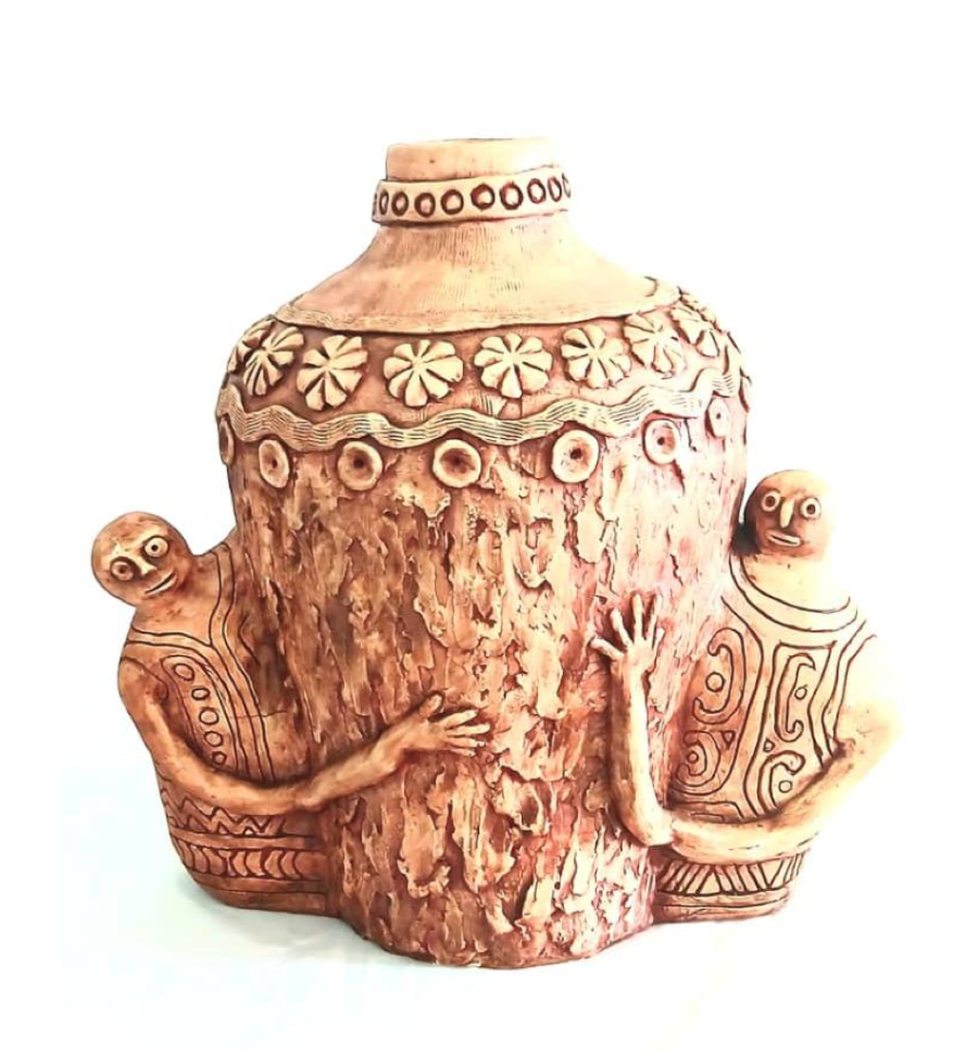Ceramic vase with artistic designs on a white background
