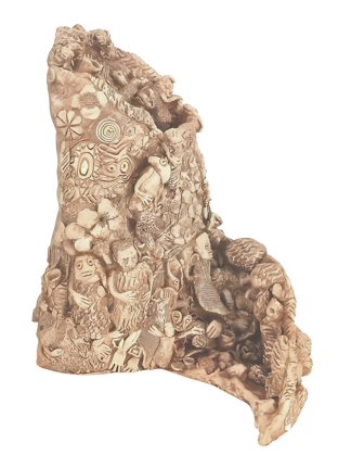 Decorative stone with intricate carvings on a white background