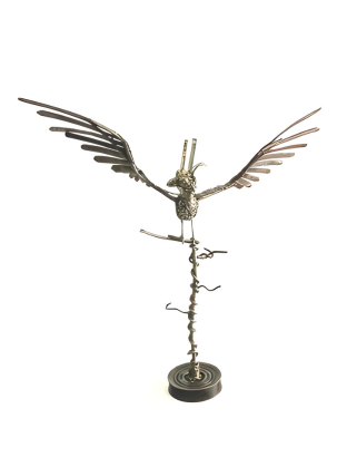 Bronze sculpture of a bird on a white background